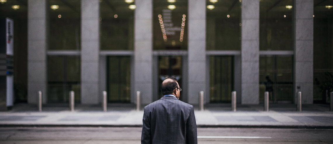 A man standing in front of a building